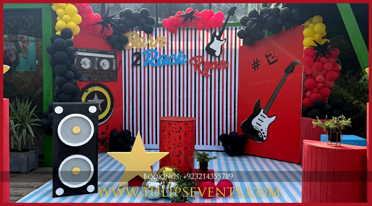 Black and gold Rock Star balloon decoration in Jhelum
