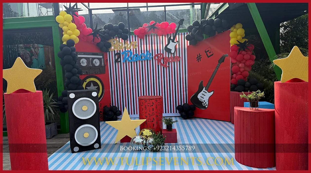 Black and gold Rock Star balloon decoration in Jhelum