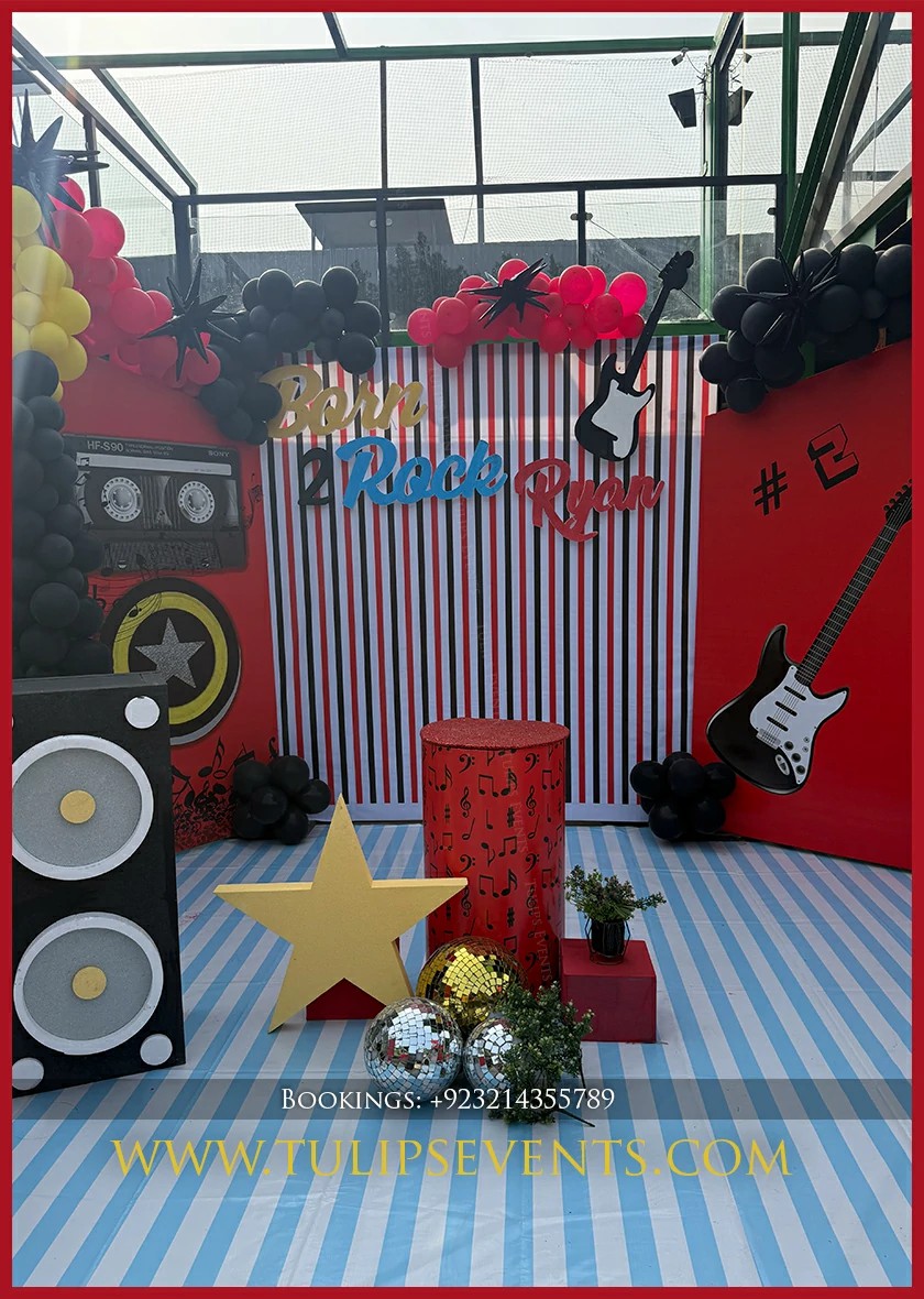 Black and gold Rock Star balloon decoration in Jhelum